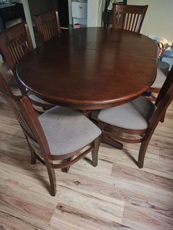 Solid wood dining table, 6 chairs.