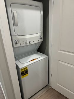 Brand new open box GE GUD27ESSM1 WW - stackable washer & dryer all in one unit