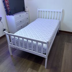 Twin white wood bed with a quality mattress 