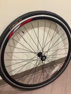 This is a 700c road bicycle wheel featuring a Compass brand tire. 28 x 15/8 x 11/8.. $50 Tire only