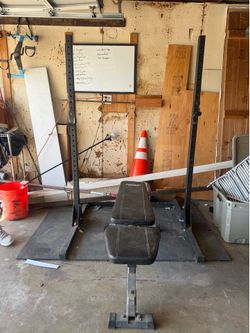 Barbell rack with adjustable bench