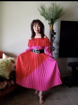 Pink and Red off thr should sundress comes in a small med and large