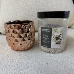 Plant pot and white pebble stones