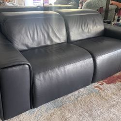 Contemporary Navy Blue leather dual power‑reclining loveseat with adjustable headrests (2019), excellent condition, low use non‑smoking home.