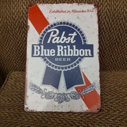 PABST BLUE RIBBON METAL SIGN.  12" X 8".  NEW. PICKUP ONLY.