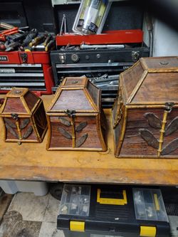 Three Wooden Boxes One Fish Inside Of The Other Inside Of The Other