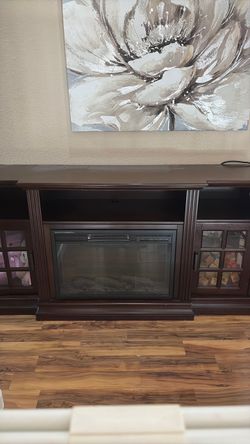 Tv entertainment center with built in electric fireplace