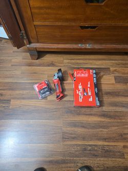 M18 Angle grinder (Like New) and (New) never used 5.0 battery