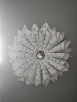 Scrolled music paper wall decor
