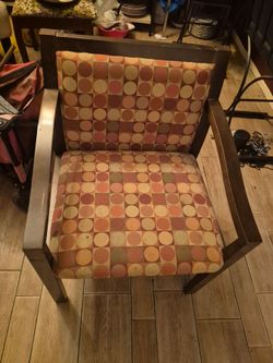 George Oliver Harkaran Upholstered Mid-Century Accent Arm Chair featuring a retro geometric circle pattern.
