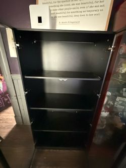 Black wooden shelving unit