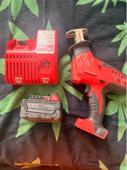 Milwaukee sawsall with battery and charger