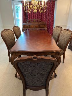 Dining table with six chairs and dining server