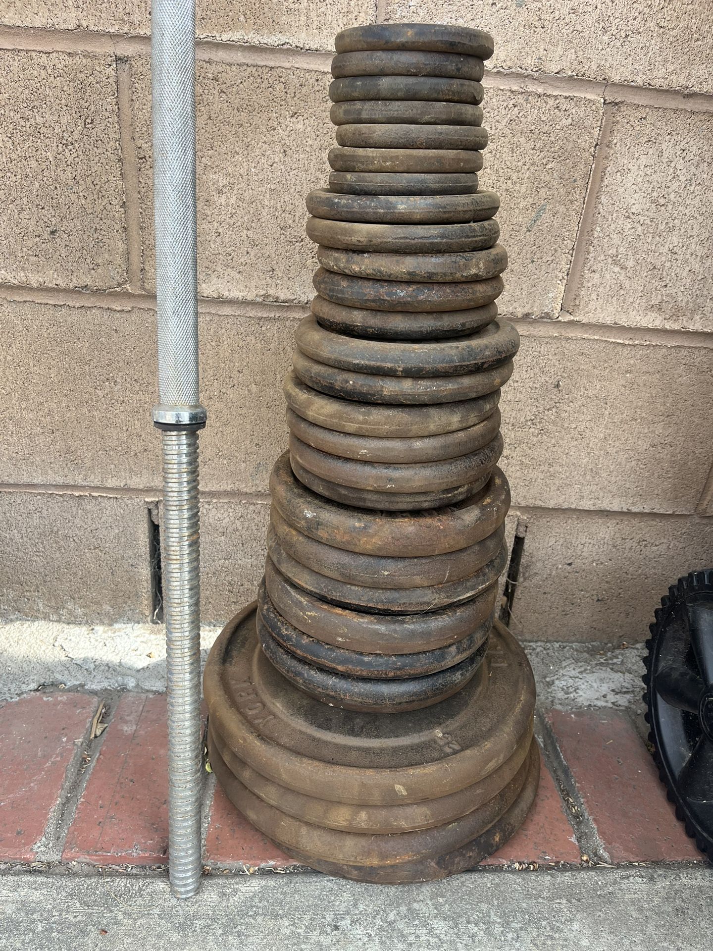 One Inch Hole Weights And Bar Total Of 240 Lbs