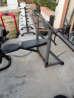 Very nice and strong weight bench with 7 ft Olympic bar. $200