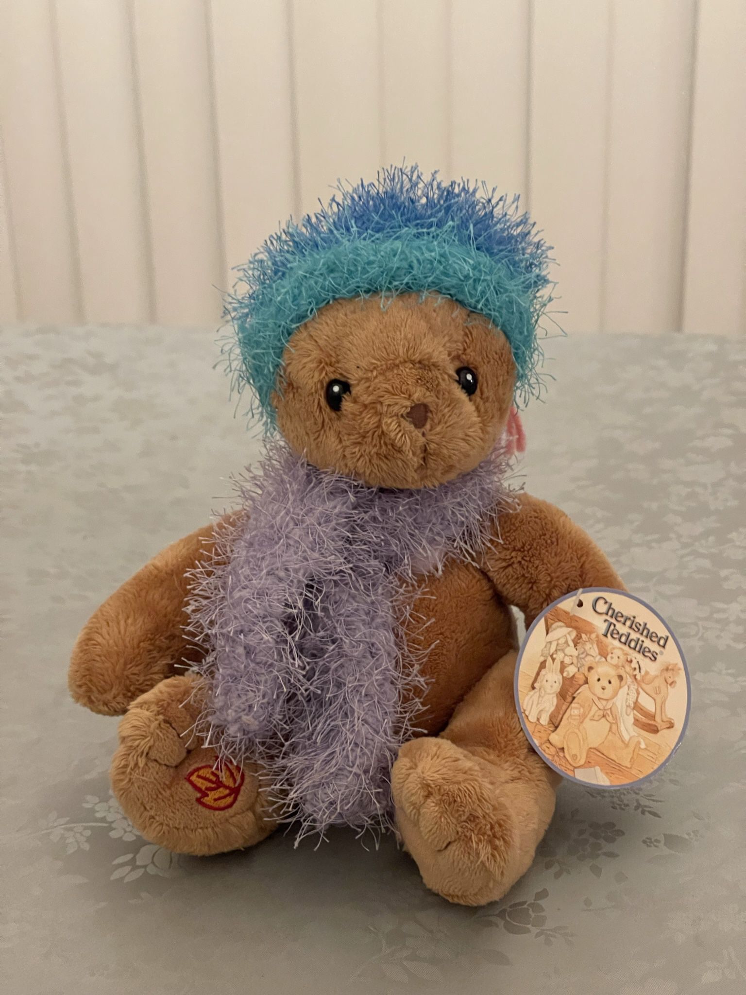 Cherished Teddy with fuzzy hat and scarf, heart on chest and leaf stitched on foot  