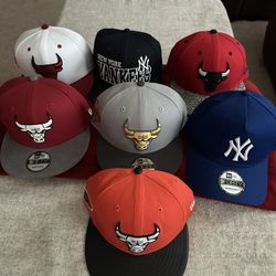 Assortment Of Fitted And SnapBack Hats