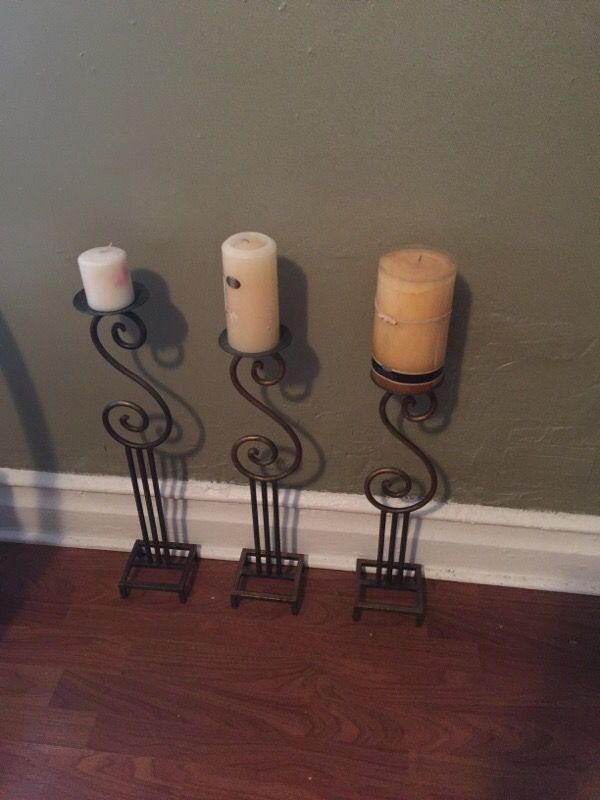 three candle holders without the candles