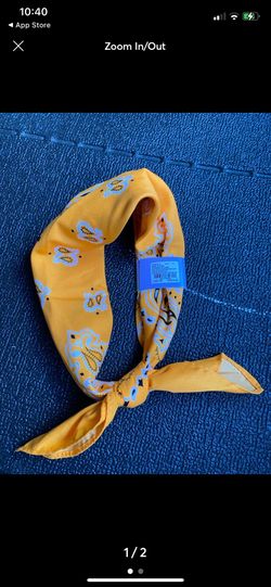 Bright yellow bandana/scarf with floral pattern.