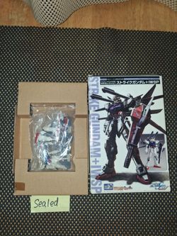 Strike Gundam Plus iwsp.. new in box sealed.. also 2 hobby Japan books.. selling as a bundle. All sales final.