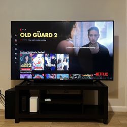 🛋️ 65” TCL Roku Smart TV + TV Stand – Great Condition!