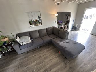 Grey L-Shaped Couch – Good Condition