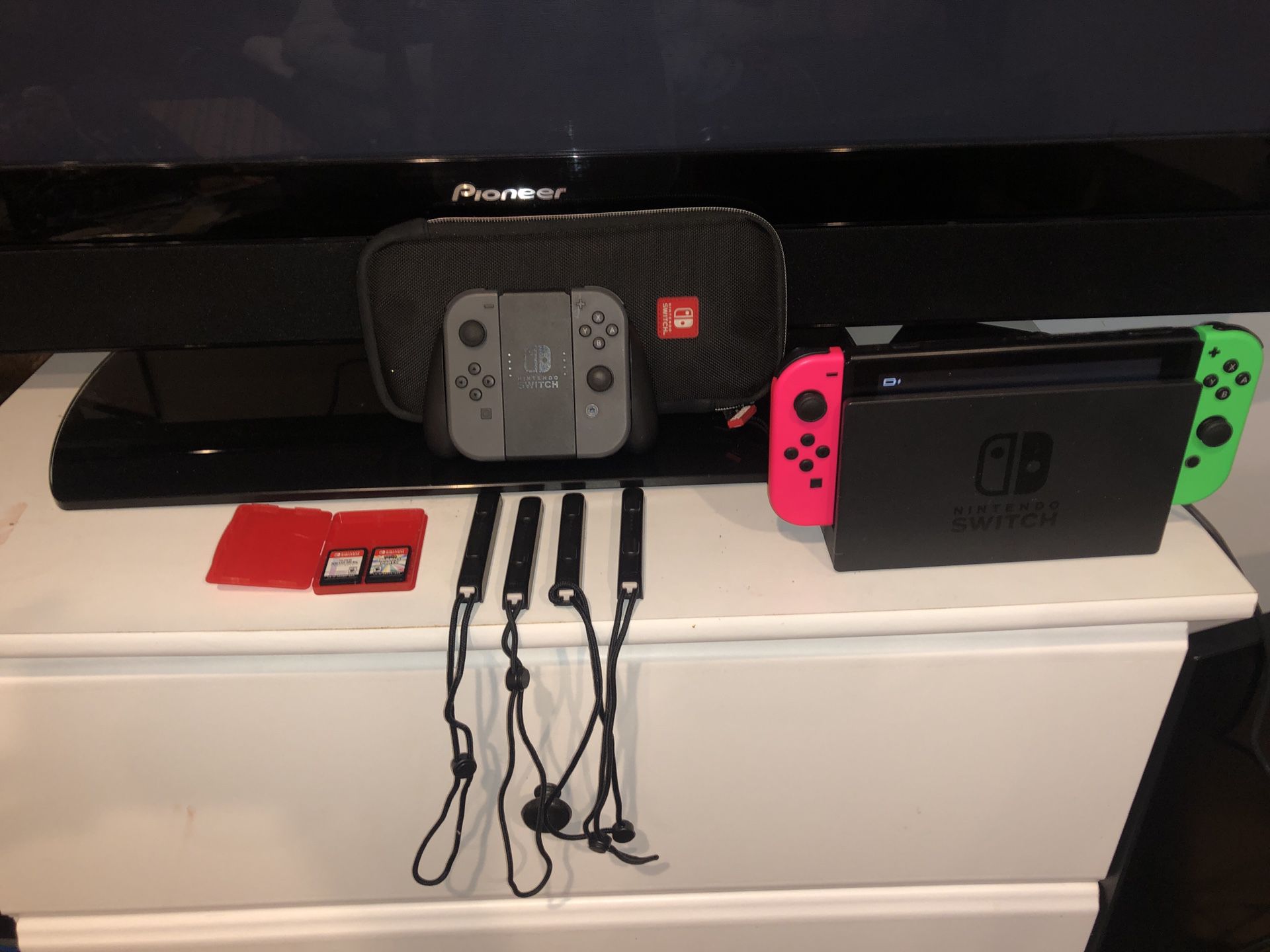 Nintendo Switch + 4 games, 4 controllers, & carrying case