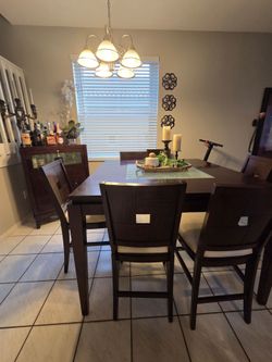 Dinning table with 6 chairs and side bar