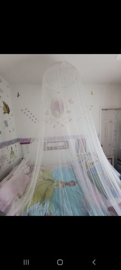 Twin bed complete with matress and Princess  & The Frog  bedding with it also