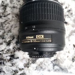 This is a Nikon AF-S DX NIKKOR 18-55mm f/3.5-5.6G VR lens. 