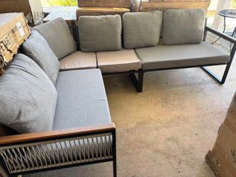 Rattan Outdoor Sofa with Gray Cushions and Steel Frame