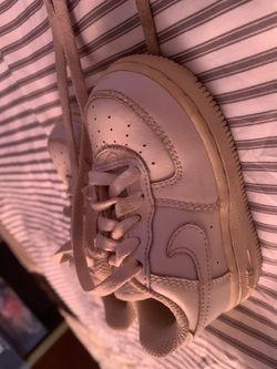 White Nikes and blue shoes