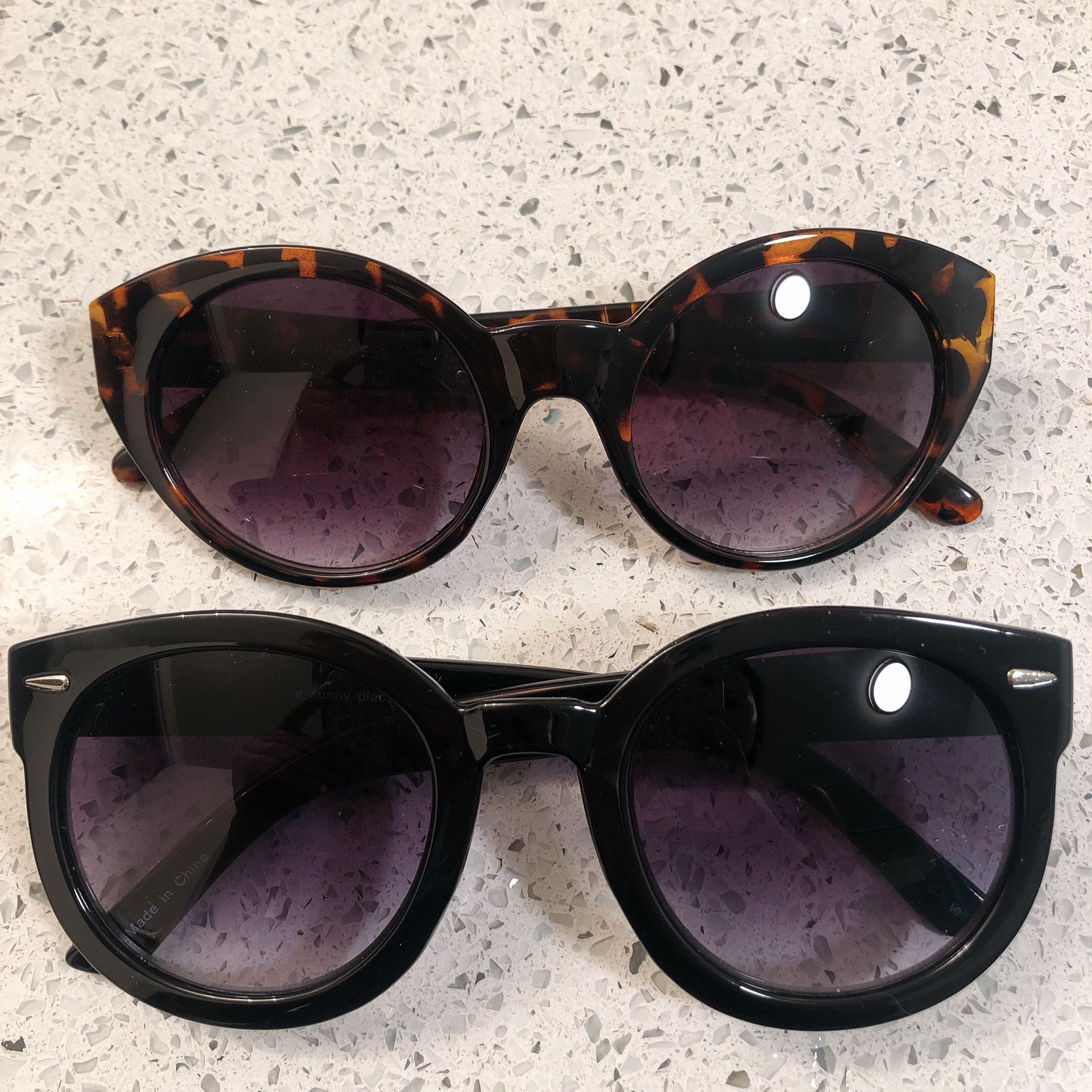 Two Urban Outfitters sunglasses