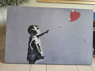 Girl with Balloon" (also referred to as "Balloon Girl" or "Girl with a Heart Balloon") by the anonymous England-based graffiti artist Banksy.