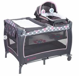Removable napper with canopy Hanging toys Flip-away changing table Storage pocket Transforms into playtime center Portable and folds compactly