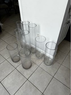 9 Glass Cilynder . 3 H 27 1/2” D6”. 2 H20”D 7 1/2”. 2 H 16”D 8” . 2 H16” D 8” . 2 H25” D 5”