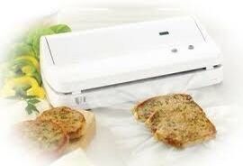 Food Saver Mini Plus w/ sealer rolls