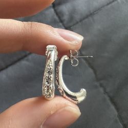 avon silver colored earrings