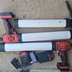 2 VEVOR Caulking Guns And Their Chargers And 1 Caulking Gun.