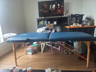 Like-New Blue Portable Massage Table with Headrest & Armrests
