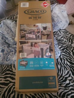 Pink Graco pack and play