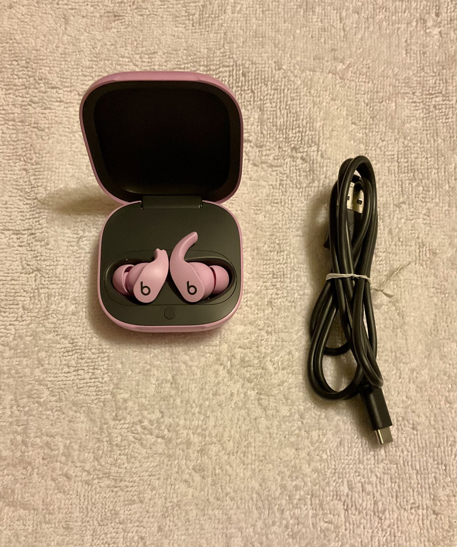 NEWER PURPLE BEATS FIT PRO, MODEL #A2577. TOP CONE MISSING ON LEFT EARBUD!