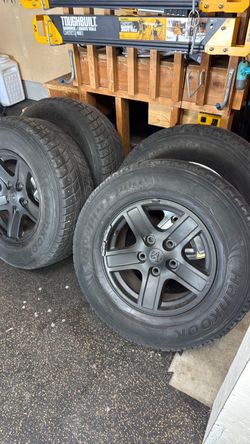 4 Dodge Ram wheels with  used snow tires