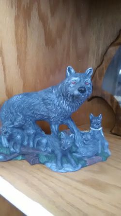 Mother wolf and pups
