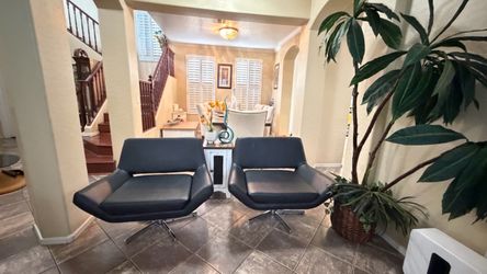 Beautiful and elegant swivel faux lounge chairs in excellent condition