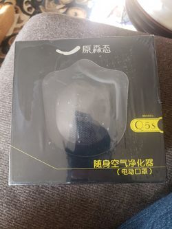 New electronic air purifying mask comes with lanyard, USB cable, filter chip, desiccant, plus more