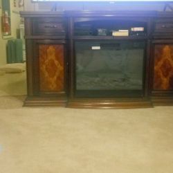 FIREPLACE. AND.  BRAND NEW. 70. SAMSUNG. 4K. SMART TV.. STILL IN THE BOX NEVER OPEN