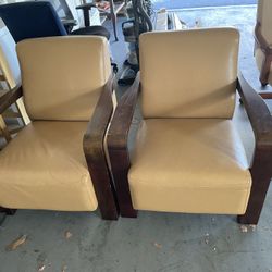 Two Italian Art Deco leather Chairs .. 