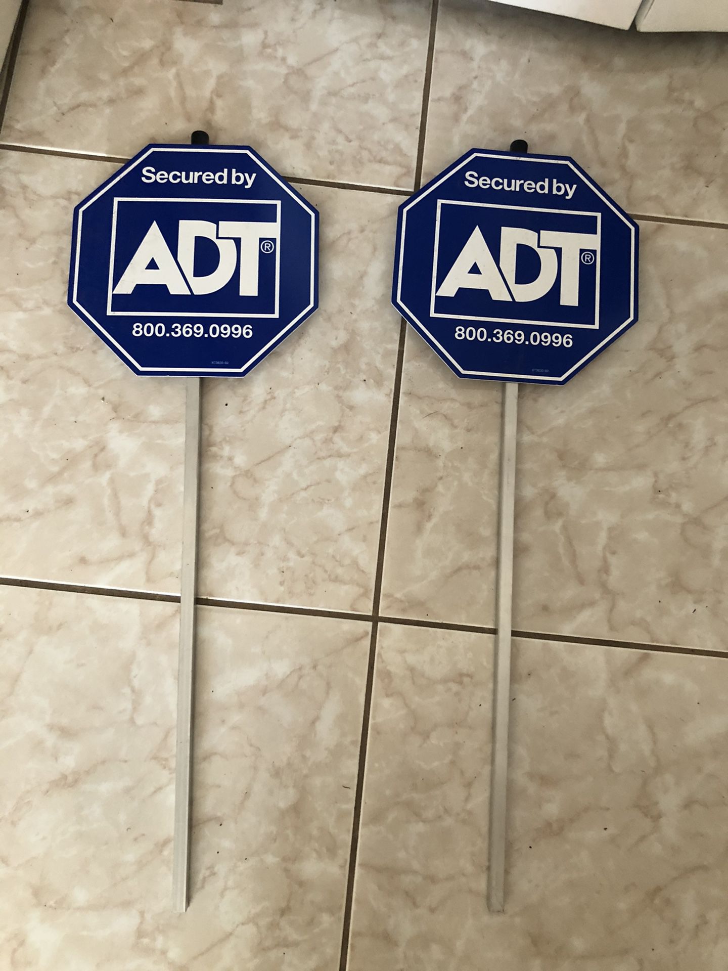 Two ADT signs