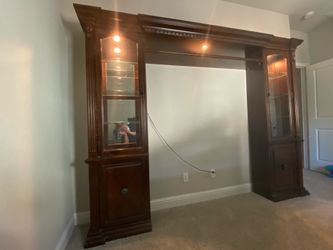 Cherry brown entertainment center with glass display cases